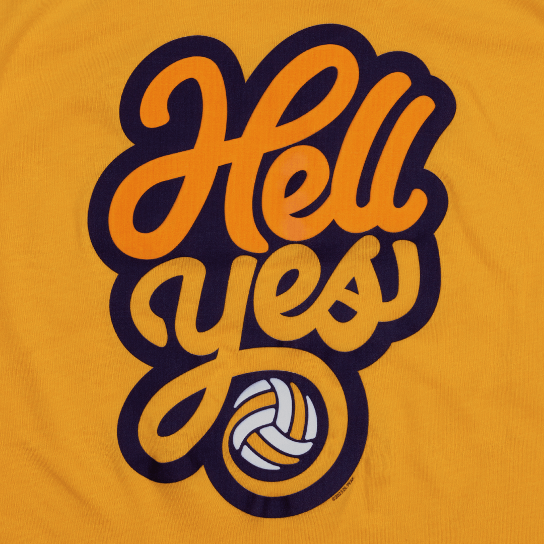 Detail of Hell Yes graphic on women's tank top. Cool graphic treatment of the words Hell yes with a volleyball. Tank top is a yellow orange. Hell is in orange. Yes is in yellow.