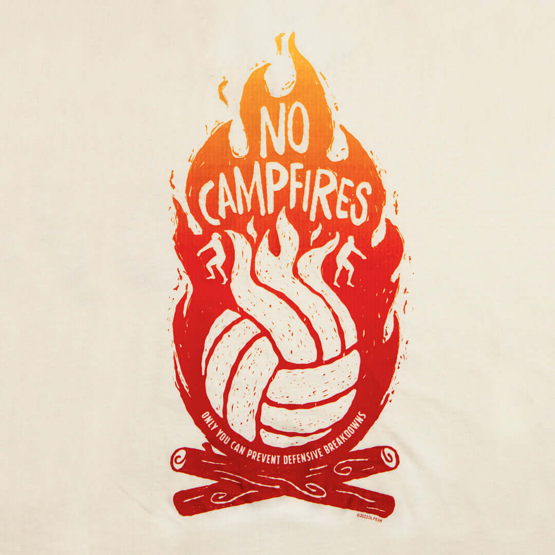 No campfires graphic volleyball tank top detail image. Back design features volleyball panels as flames in shirt color in the middle of campfire. Type reads, "only you can prevent defensive breakdowns." Tank top is natural color. Graphic is gradient of da